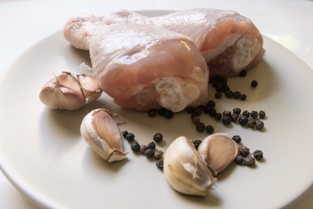 A plate of raw chicken  ledsの写真素材