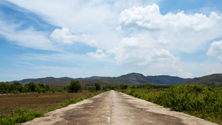 landscape with road and mountainsの写真素材