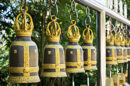 Buddhist bells inside the temple. Vertical shot.