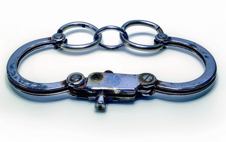 Elevating Security with Handcuff Technology On White Background Generative By Ai.の素材
