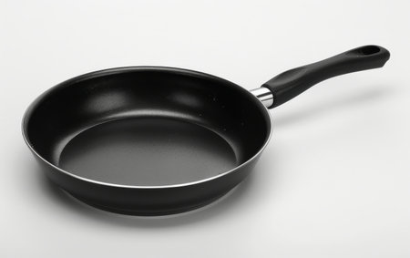 Navigating Precision with the Versatile Frying Pan On White Background Generative By Ai.の素材