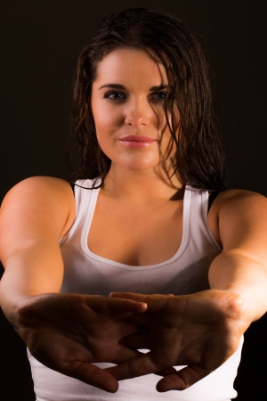 Female sports trainer warming upの写真素材