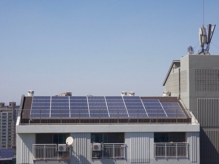 Apartment roof with solar panelsの写真素材