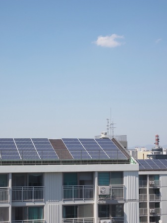 Apartment roof with solar panelsの写真素材