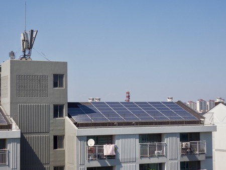 Apartment roof with solar panelsの写真素材