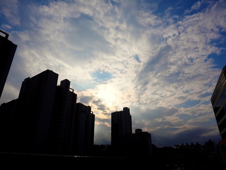 Clouds and buildings in the Korean city centerの写真素材