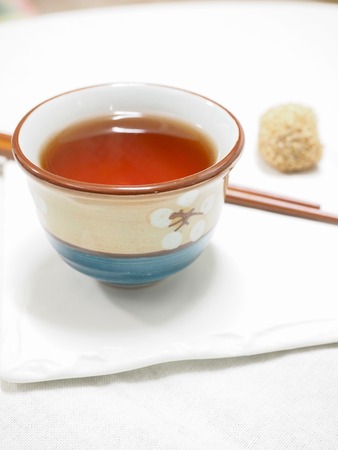 black tea, tea, porcelain, rice cake, chopsticks, white background,の写真素材