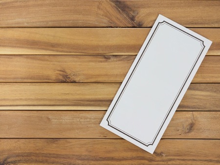 Blank frame on wooden backgroundの写真素材