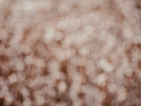 Brown background with white bokeh, focus blurの写真素材