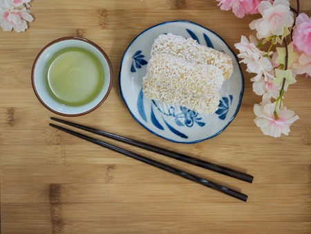 Korean traditional sweets yugwa and green tea and cherry blossomsの写真素材