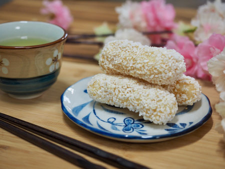 Korean traditional sweets yugwa and green tea and cherry blossoms