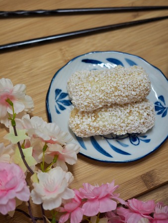 Korean traditional sweets yugwa and green tea and cherry blossomsの写真素材