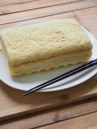Korean traditional food yellow steamed rice cakeの写真素材