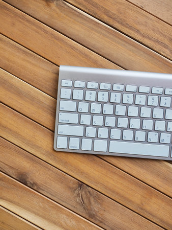 Wooden board with white keyboard