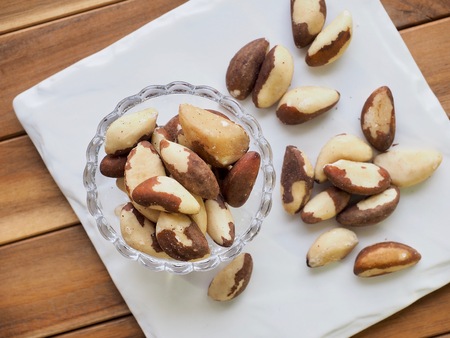 Brazilian nuts and glass bowlの写真素材