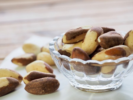 Brazilian nuts and glass bowlの写真素材
