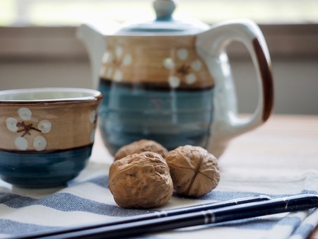 Walnuts and green teaの写真素材