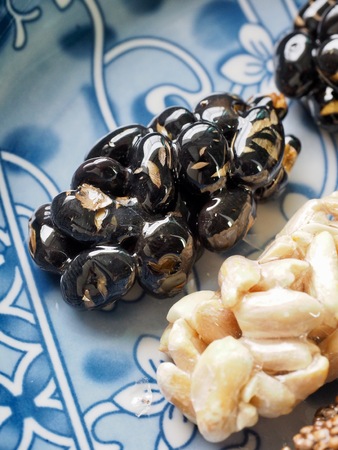 Korean traditional snacks Sweet Rice Puffs, Black sesame gangjeong, Peanut gangjeongの写真素材