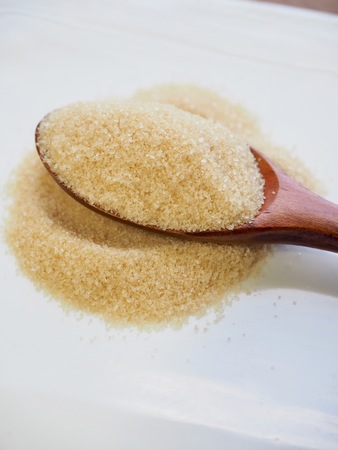 Brown powdered sugar in a spoonの写真素材