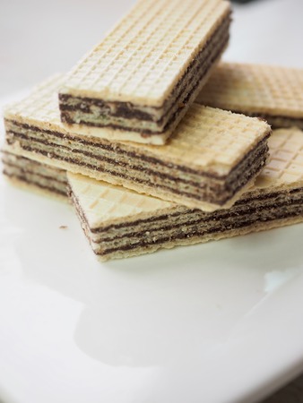 Chocolate crackers in a white dishの写真素材
