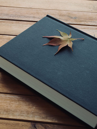Book and Maple Leaf