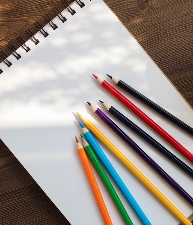 Sketchbooks, colored pencils and coffeeの写真素材