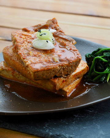 Asian food Tofu simmered in soy sauce and spinach, Dubu-jorim, Stewed tofu, Braised Tofu
