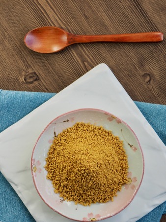 Yellow curry powder in a plateの写真素材