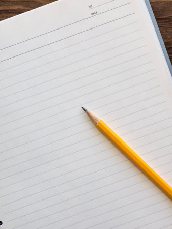 White notebook and pencil