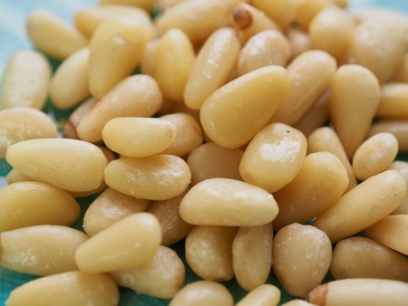 Pine nuts in a porcelain dishの写真素材