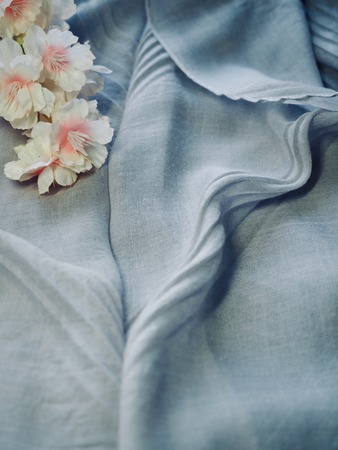 cherry blossoms and cotton fabric backgroundの写真素材