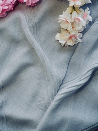 cherry blossoms and cotton fabric backgroundの写真素材
