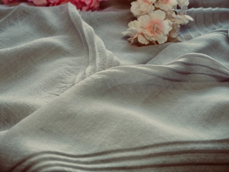 cherry blossoms and cotton fabric backgroundの写真素材