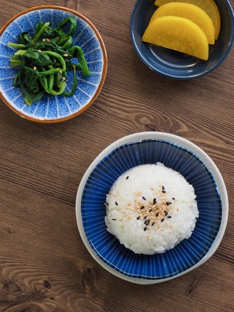 White rice and spinach and Pickled radishの写真素材