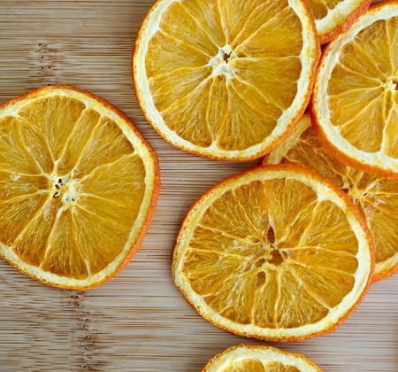 Wooden board background with dried orangeの写真素材