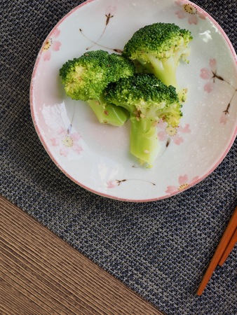 Broccoli, chopsticks and porcelain potの写真素材