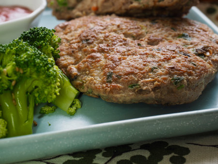 Hamburger steak, broccoli, ketchup and fruit