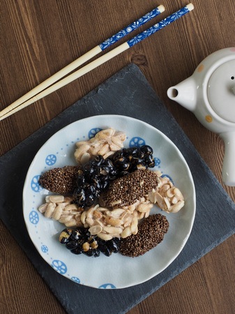 Korean traditional snacks Sweet Rice Puffs, Black sesame gangjeong, Peanut gangjeongの写真素材