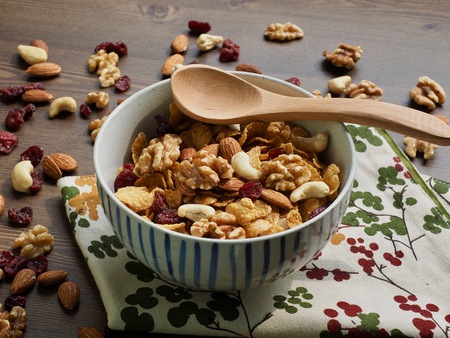 Spoon with cereal and nut mixの写真素材