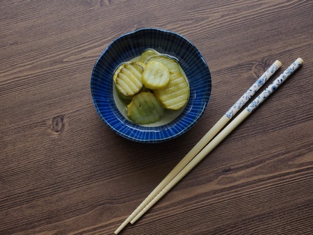 side dish Cucumber pickle and chopsticksの写真素材