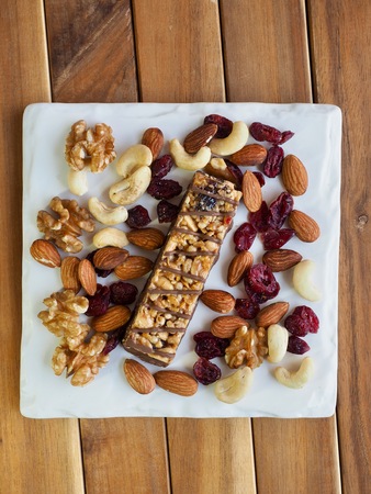 Chocolate bar and nuts, Almonds, walnuts, raspberries, Cashew nutの写真素材