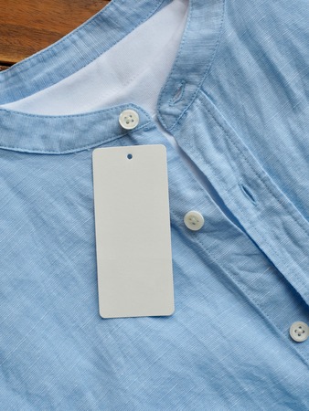 Blue linen shirt and clothing label, summer clothingの写真素材