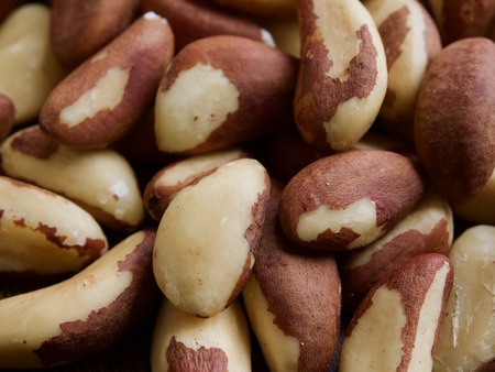 Brazil nuts on wooden boards, nutsの写真素材