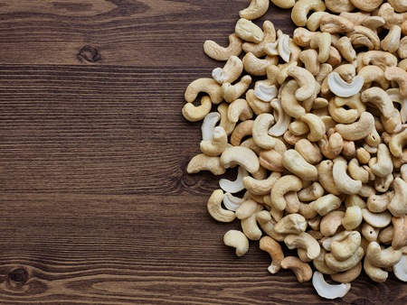 Cashew nuts with wooden boardの写真素材
