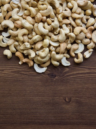 Cashew nuts with wooden boardの写真素材