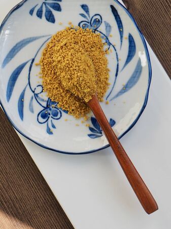 Yellow curry powder in a plateの写真素材