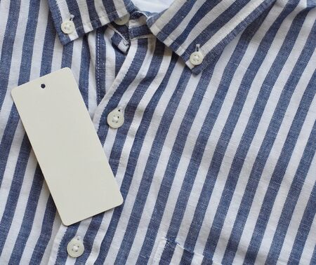 Striped linen shirt and clothing label, summer clothingの写真素材