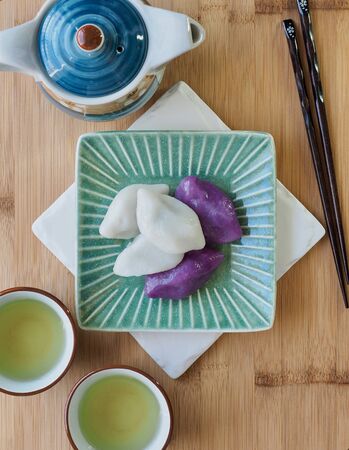 Korean food Songpyeon, half-moon-shaped rice cake with green teaの写真素材