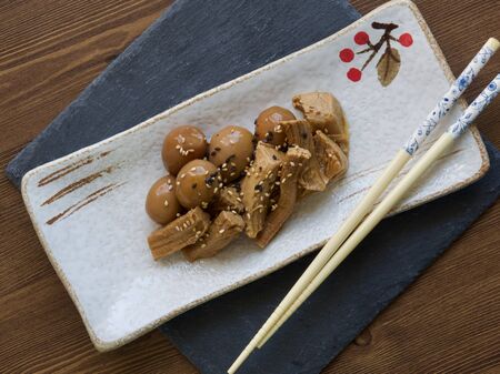 Asian food pork and quail eggs with soy sauceの写真素材