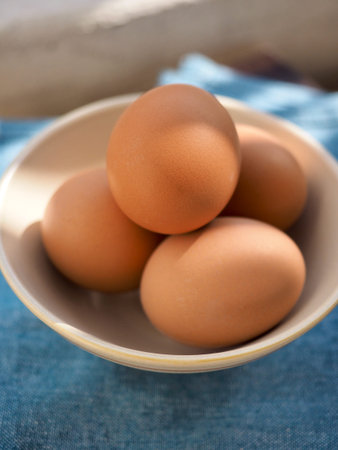 Fresh eggs in a porcelain bowl